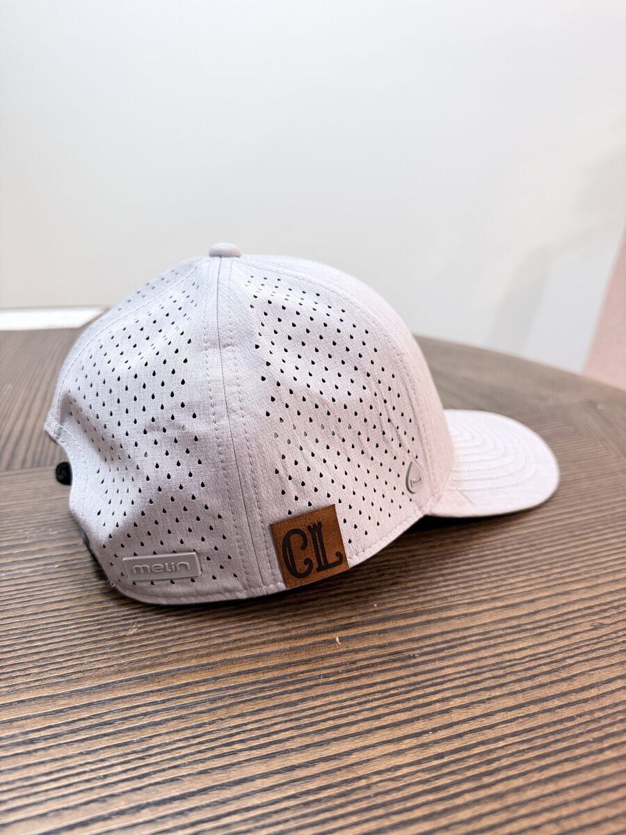 Custom event hat with a laser-engraved leather patch tag